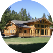 Picture of big log cabin from company retreat