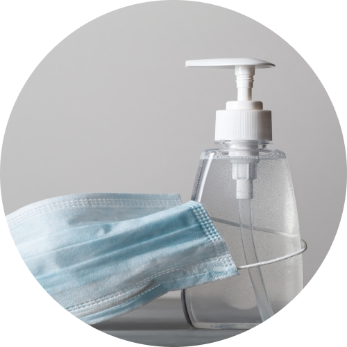 pandemic supplies face mask around unlabeled hand sanatizer bottle