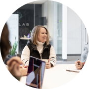 Crissy Pagulyan, Project Manager, sits in one of SiteCrafting's conference rooms