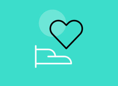 Green background with hand holding a heart