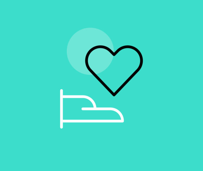 Green background with hand holding a heart