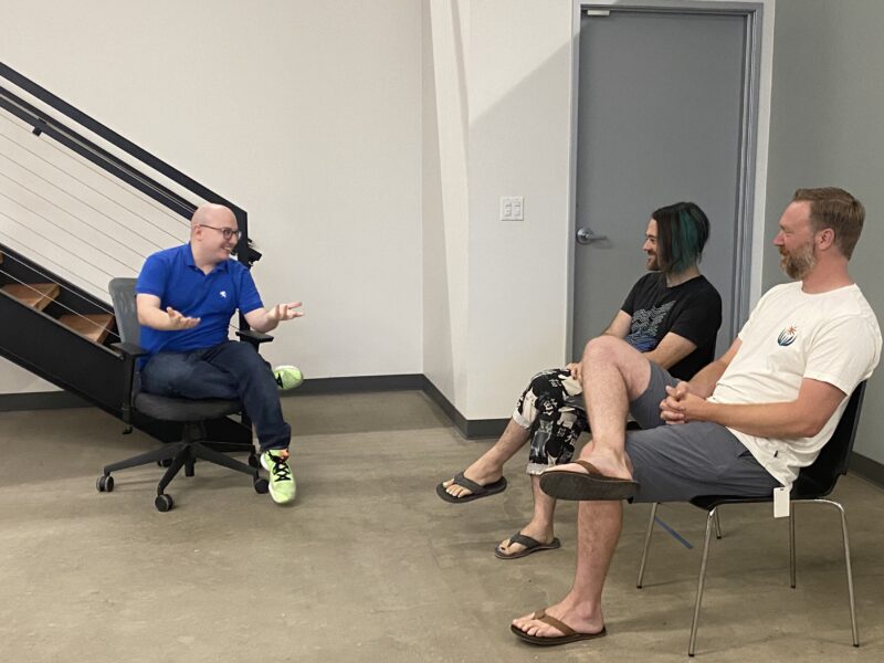 Daniel Phil and Glen engaged in an improv activity.