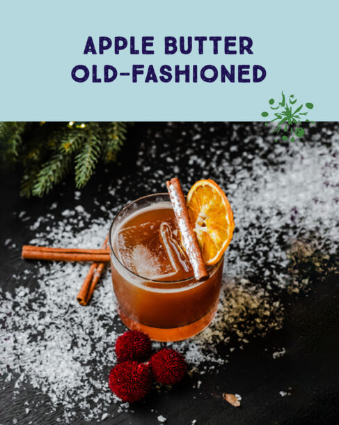 Apple Butter Old-Fashioned. A cocktail garnished with an orange wheel and stick of cinnamon.