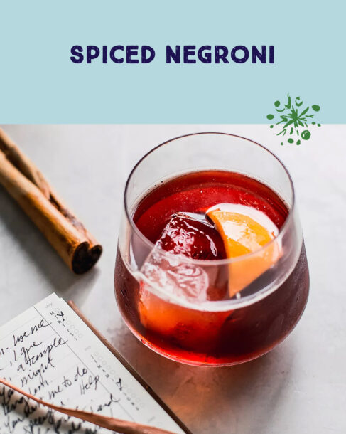 Spiced Negroni, a filled rocks glass with an orange garnish.