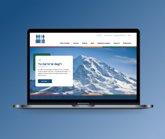 Laptop displaying the Puyallup Tribal Health Authority website's home page, which features a snowy mountain landscape and the Lushootseed phrase for 