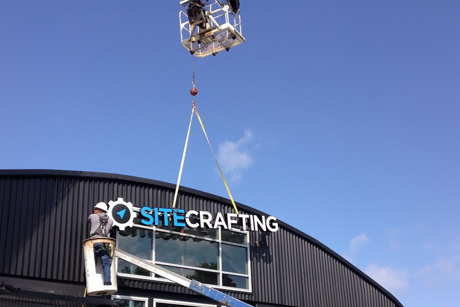 Signage installation at the new SiteCrafting headquarters 