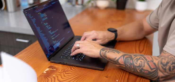 laptop screen with code being worked on.