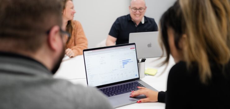 Employees gathered together in a conference room.