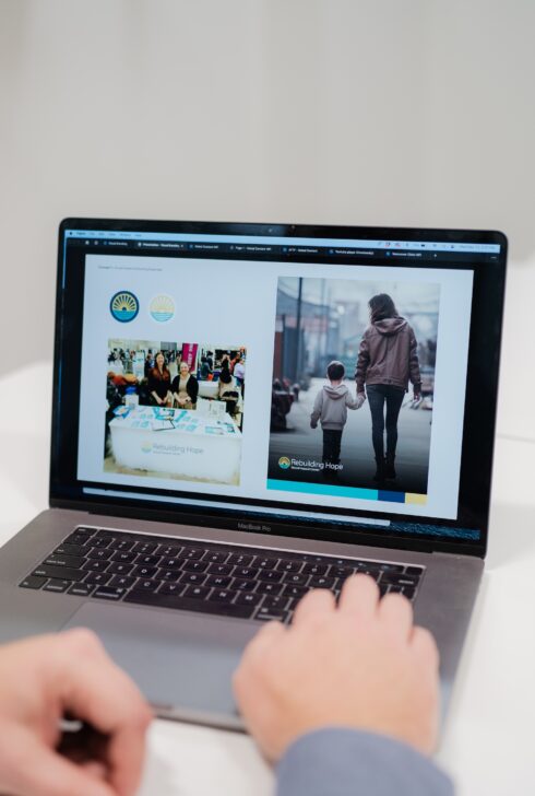 Laptop showing new rebrand of Rebuilding Hope.
