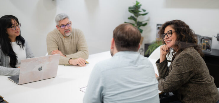 Employees brainstorming in a conference room.