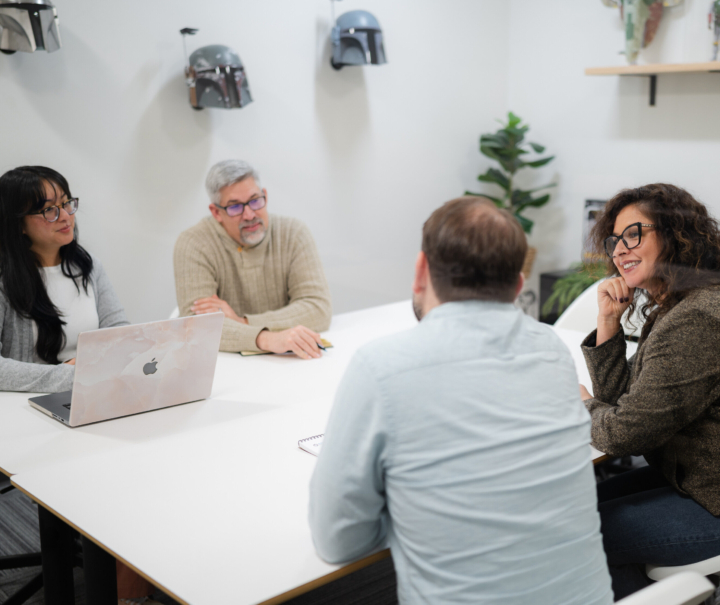 Employees brainstorming in a conference room.