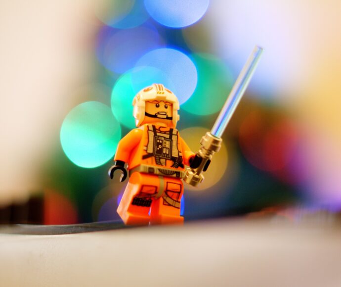 Luke Skywalker Lego character holding lightsaber