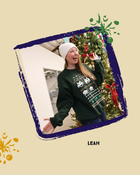 SiteCrafting employee Leah in a white beanie and a green 