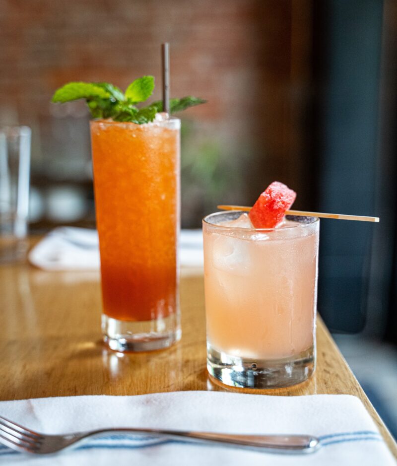 Two cocktails served on the bar