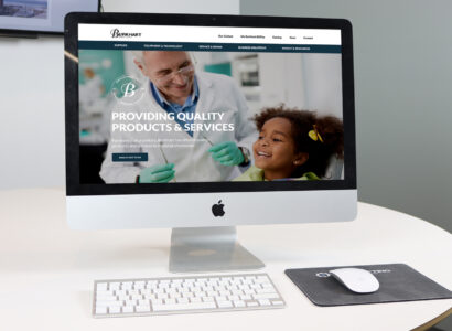 iMac showing the Burkhart website.