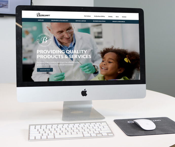 iMac showing the Burkhart website.