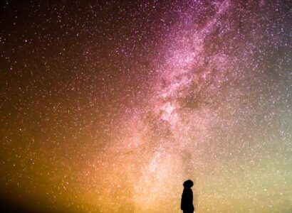 Person stares into starry sky