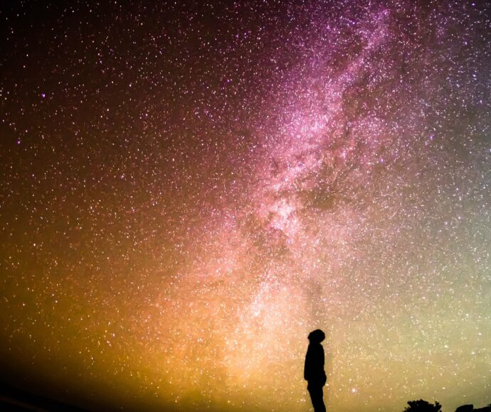 Person stares into starry sky