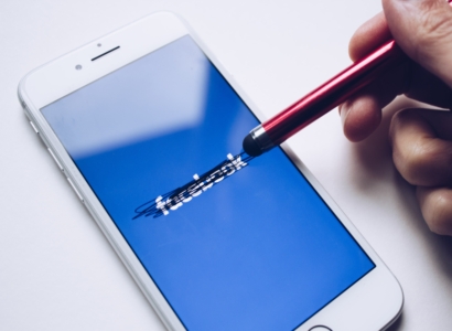 Facebook blacked out on mobile phone screen.