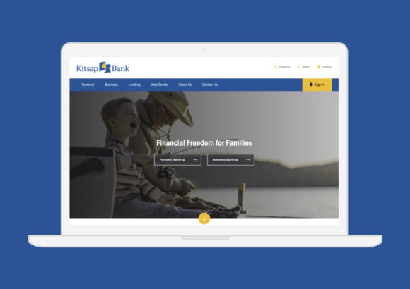 Laptop showing the Kitsap Bank website.