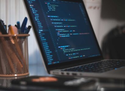 Code shown on a laptop screen.