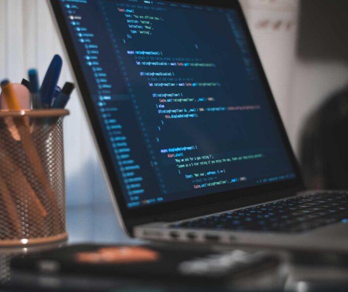 Code shown on a laptop screen.
