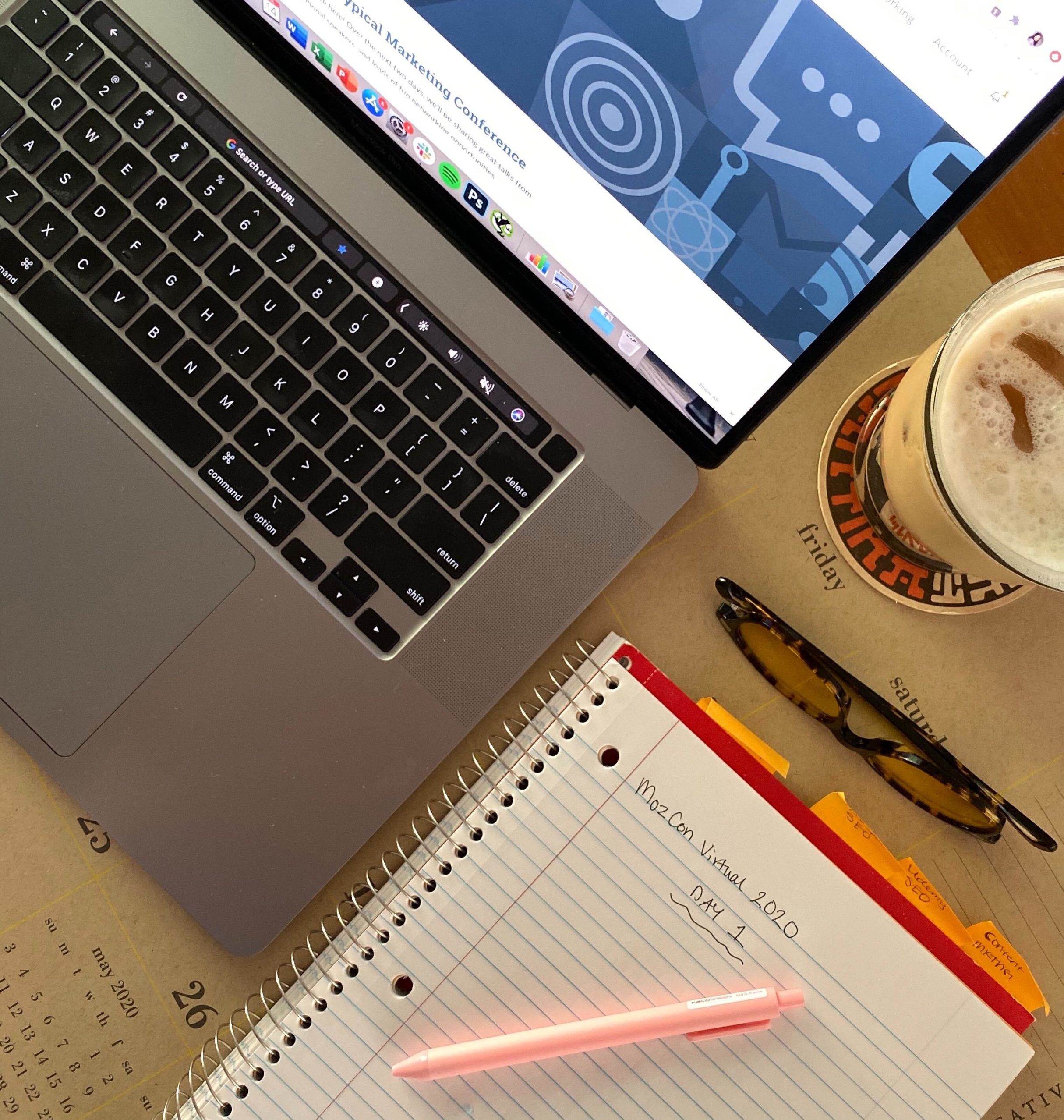 MozCon Virtual 2020 marketing conference note pad next to laptop.