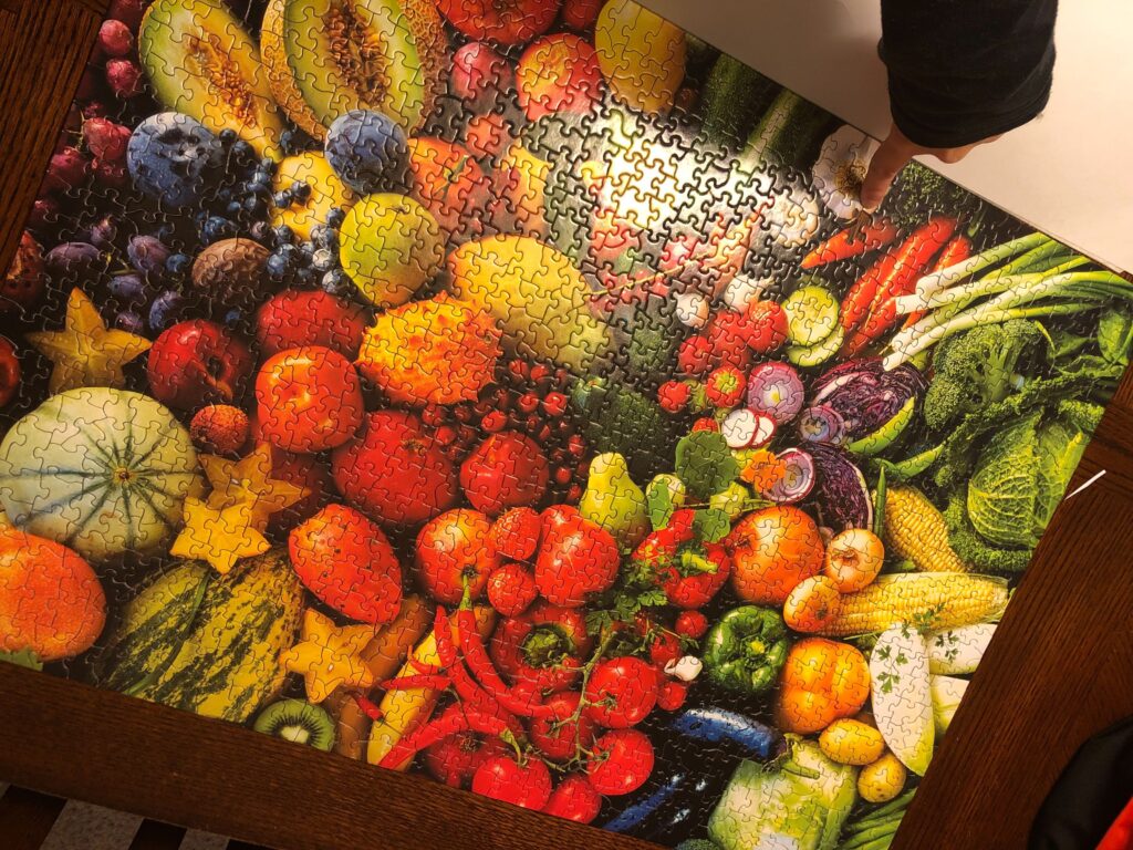 A completed 1000 piece puzzle of fruits and vegetables