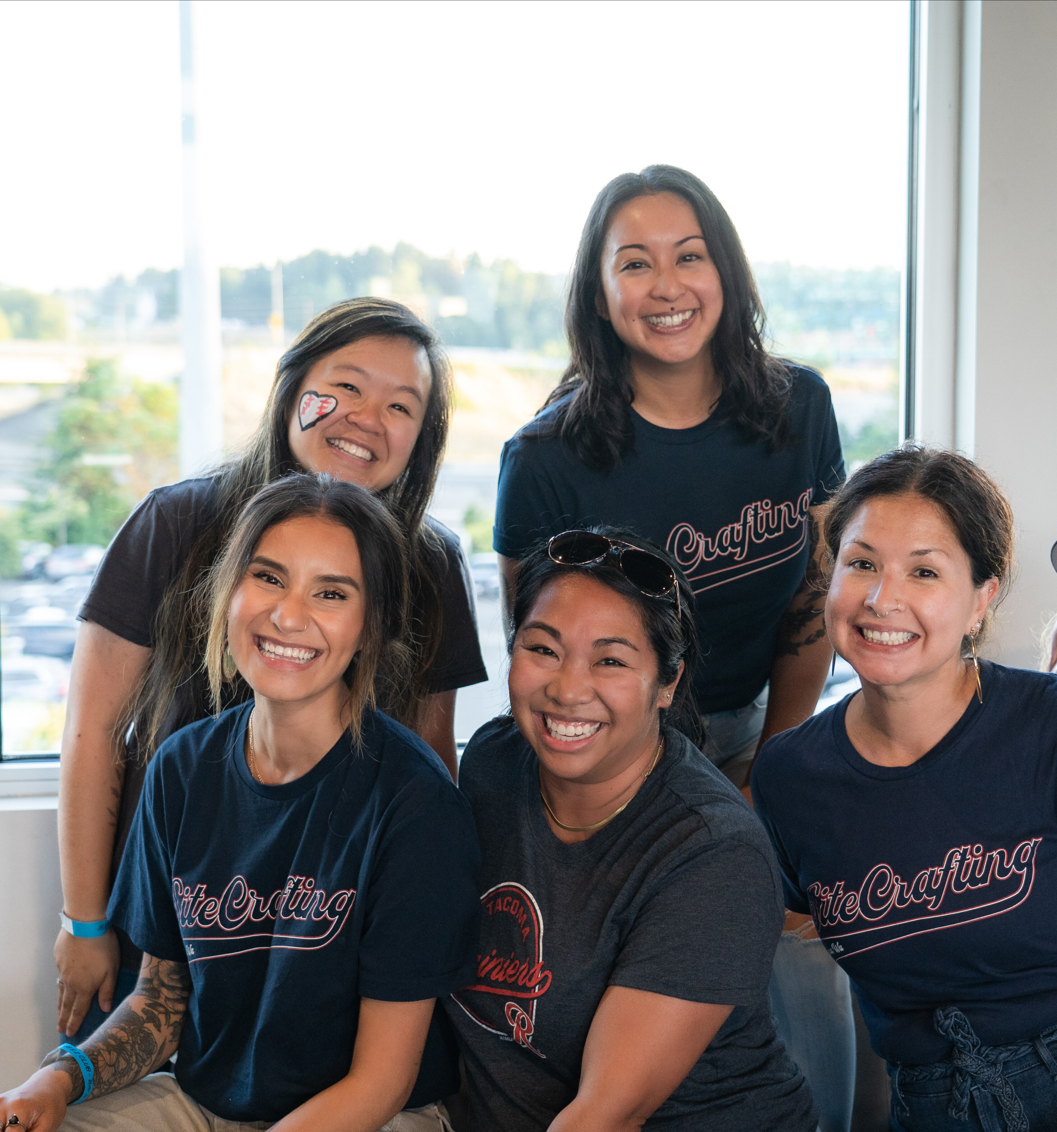 Female coworkers at The Rainiers baseball game