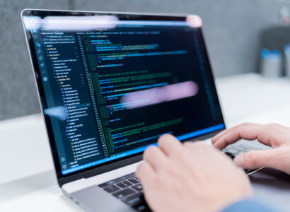 Typing on code on laptop