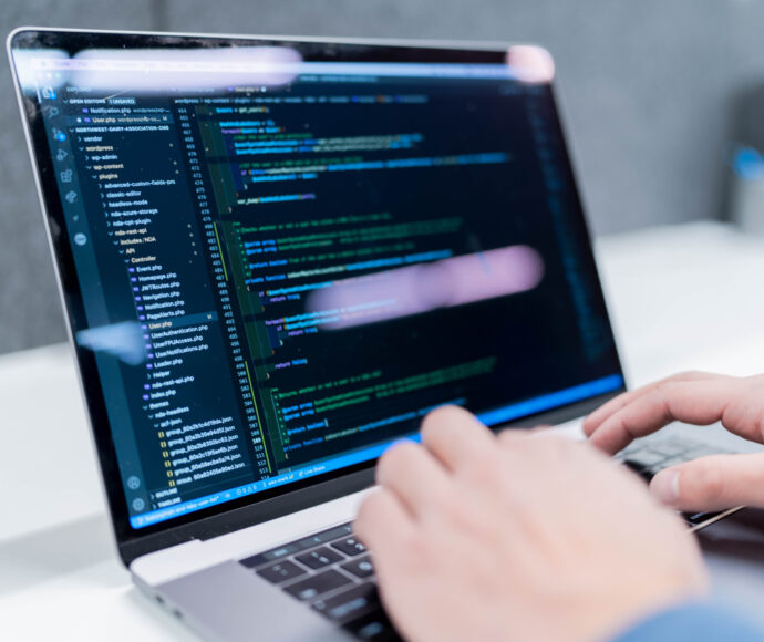 Typing on code on laptop