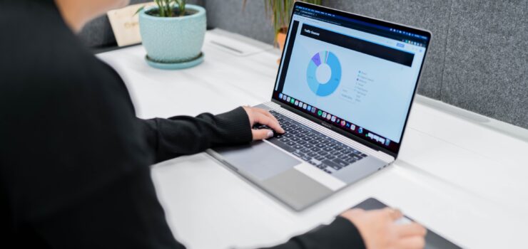 Looking at analytics on a laptop screen.