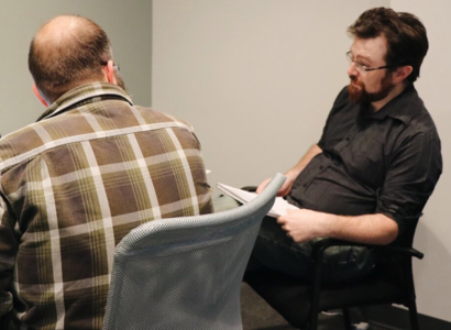 Scott Dunham and Joe Izenman collaborating at a laptop.
