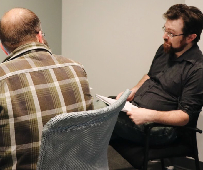 Scott Dunham and Joe Izenman collaborating at a laptop.
