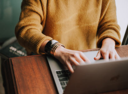 Woman working on a laptop.