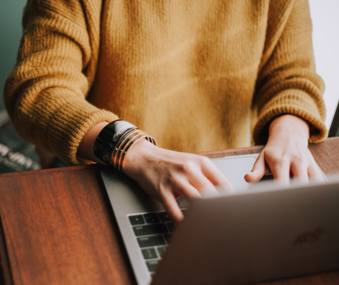 Woman working on a laptop.